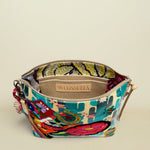 Point of Origin CONSUELA Desi Downtown crossbody bag with vibrant cactus print, embroidered patches, and interior slip pocket.