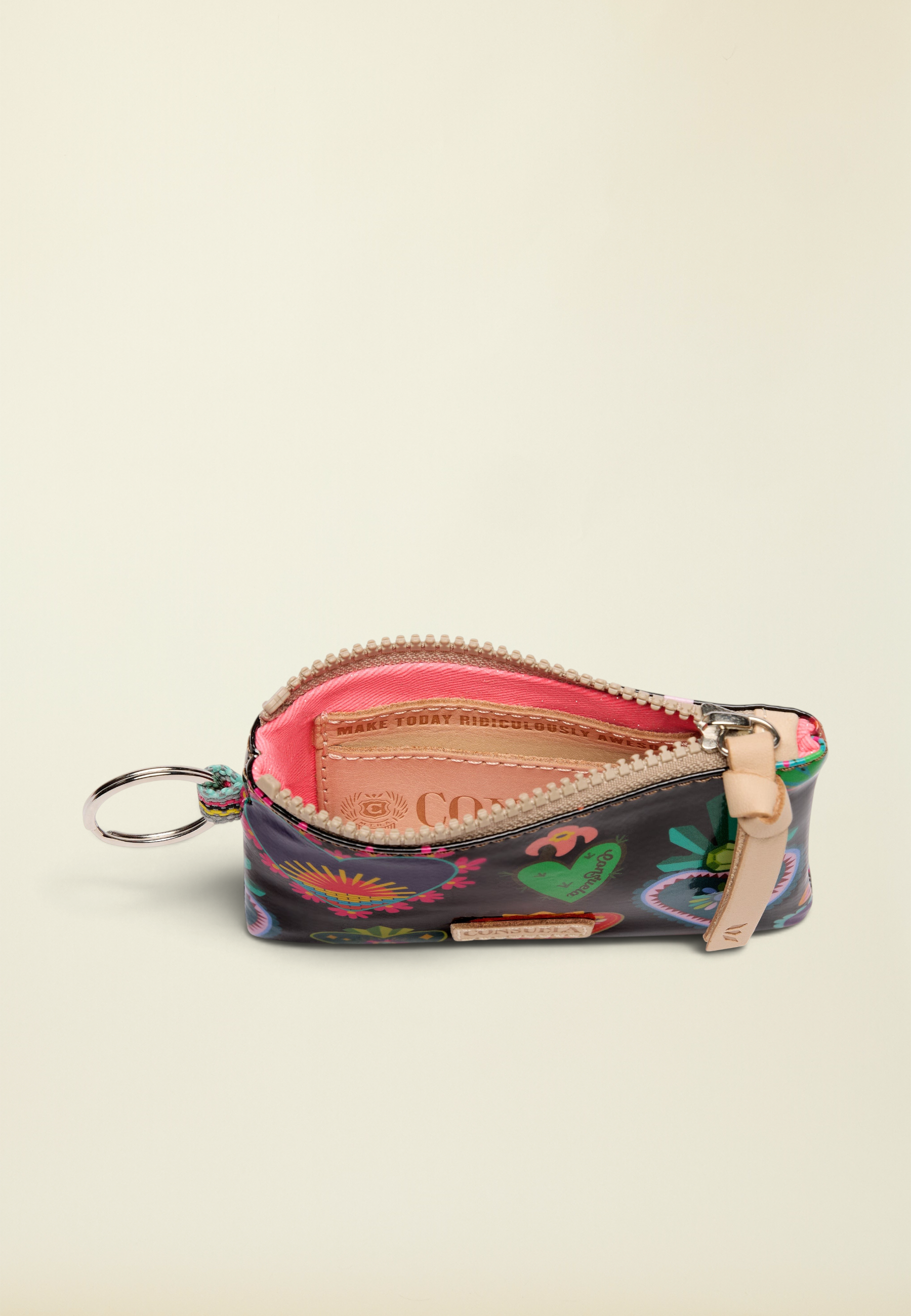 Point of Origin Consuela Vida Pouch in navy with colorful bug print, pink interior, and natural leather zipper pull.