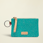 Point of Origin Consuela Shay glitter pouch in teal with natural leather pull, logo patch, and attached metal keyring.