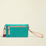 Point of Origin Consuela Shay Uptown Crossbody in teal with natural leather trim, wristlet strap, and zipper pocket.