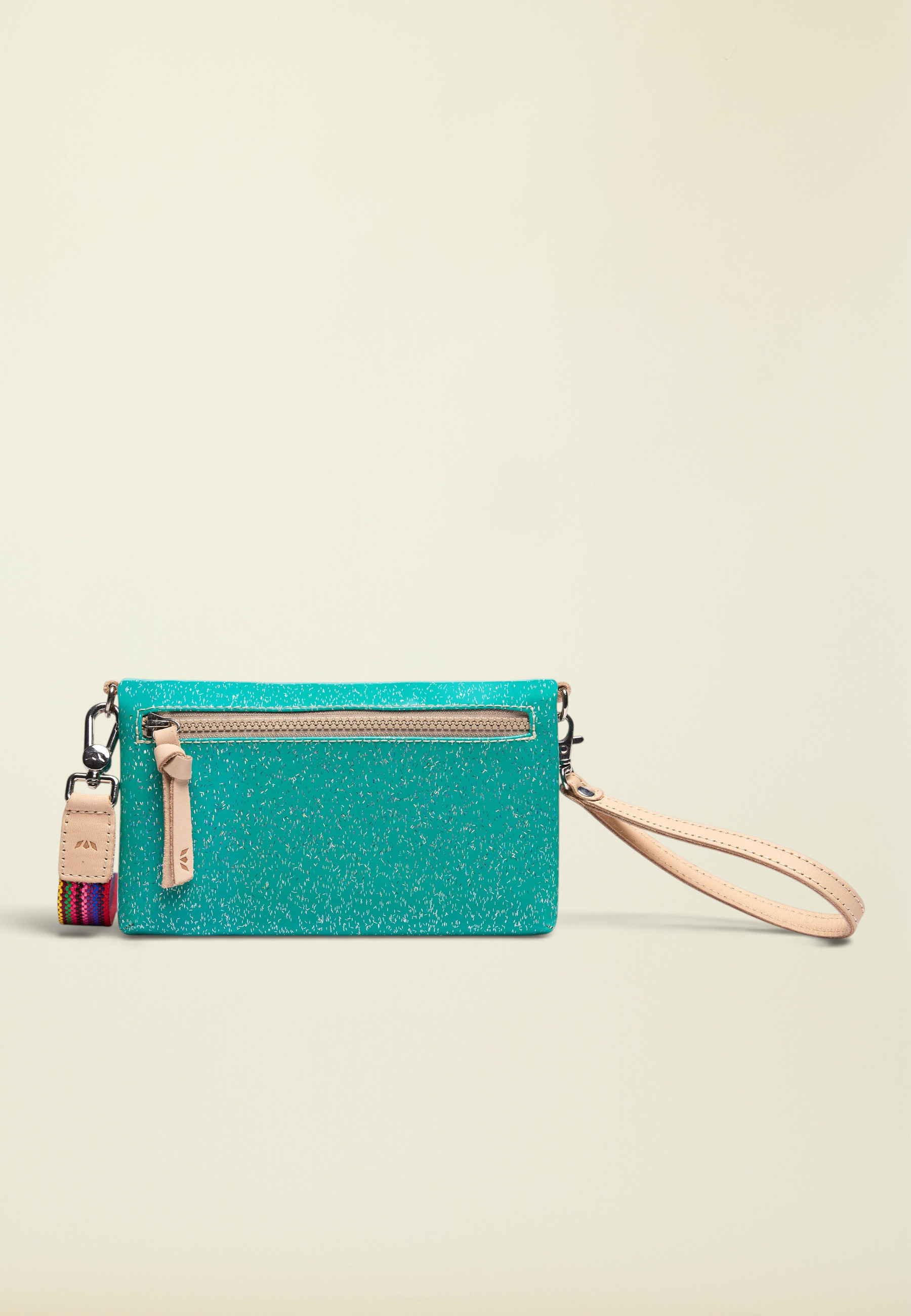Point of Origin Consuela Shay Uptown Crossbody in teal with natural leather trim, wristlet strap, and zipper pocket.