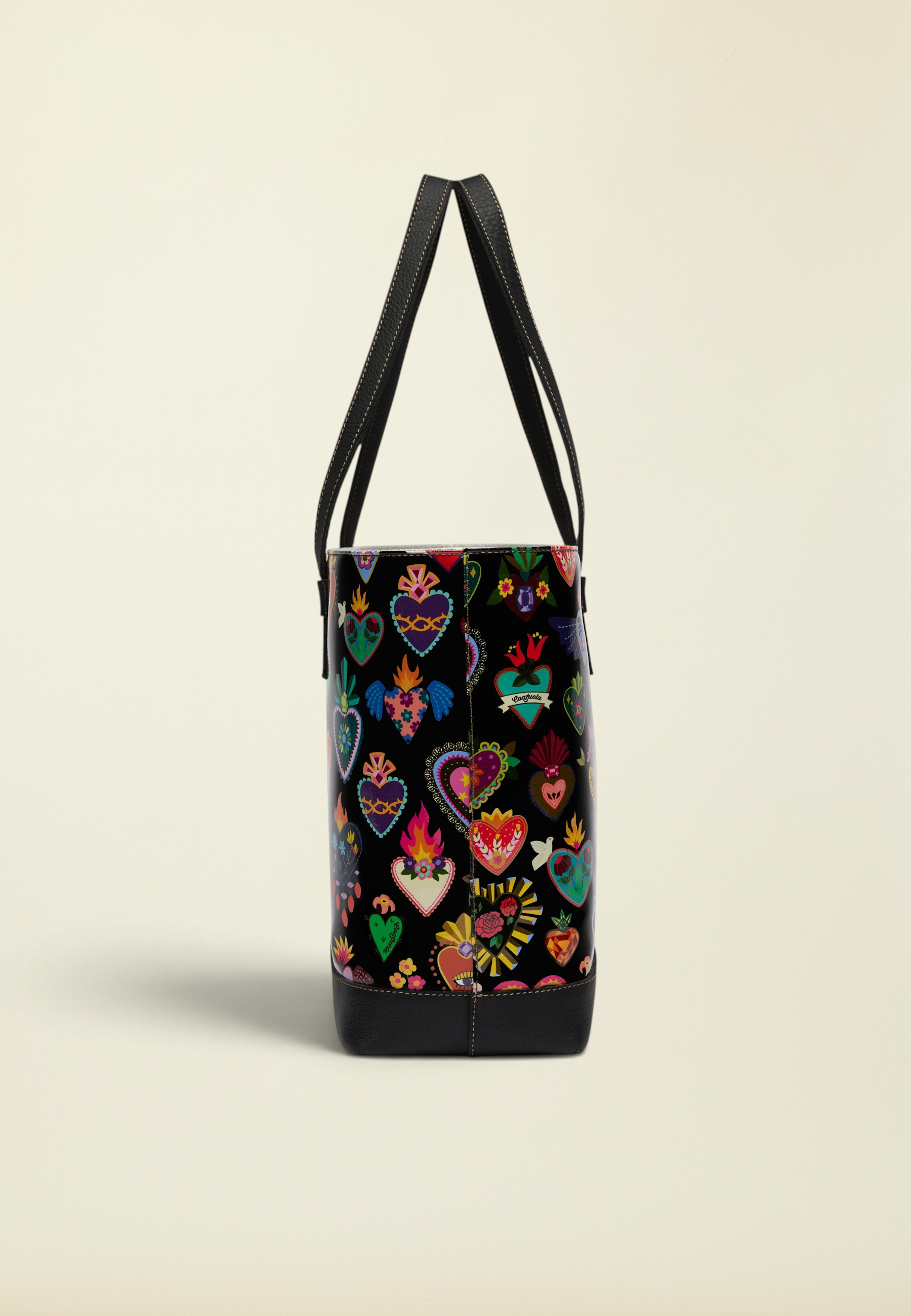 Point of Origin Consuela Vida Big Breezy tote bag featuring a black ConsuelaCloth exterior with colorful heart motifs