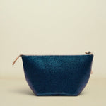 Blue denim pouch with gold zipper on a white background