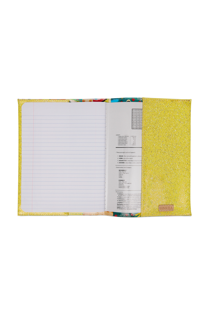 Open notebook with lined pages and colorful cover on a white background