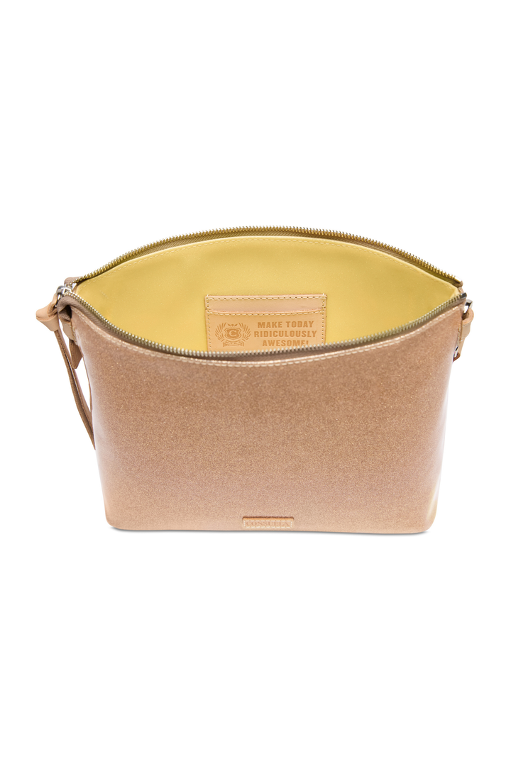 Beige crossbody bag with a visible brand label on a white background