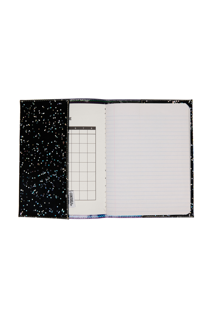 Notebook with starry night design on cover and grid and lined pages inside