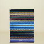 Multicolored striped towel with a brand logo on a white background