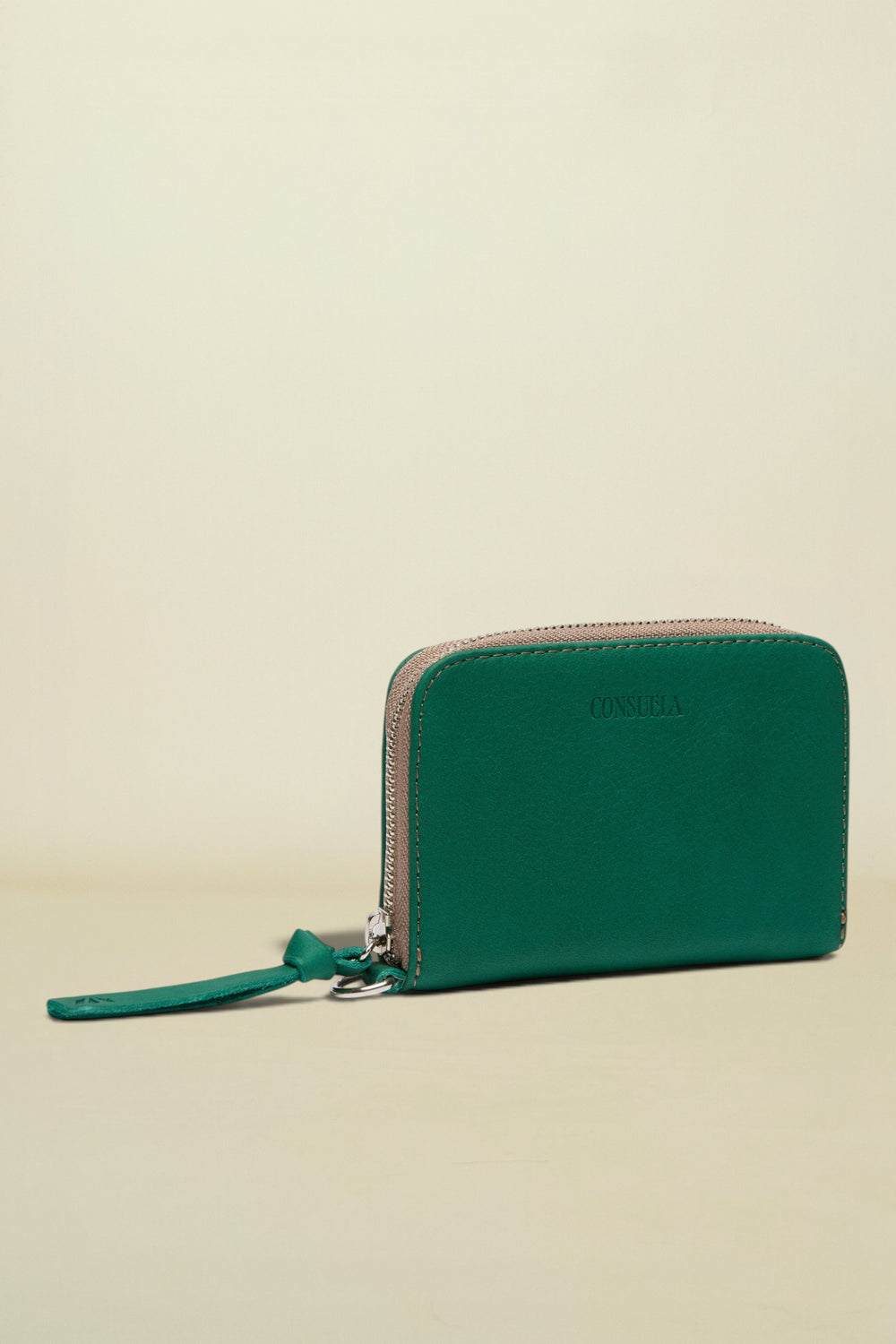Green wallet with a strap on a white background
