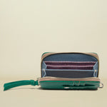 Small zippered pouch with a colorful interior on a white background