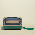 Green wallet with a zipper on a white background