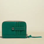 Green wallet with a zipper on a white background