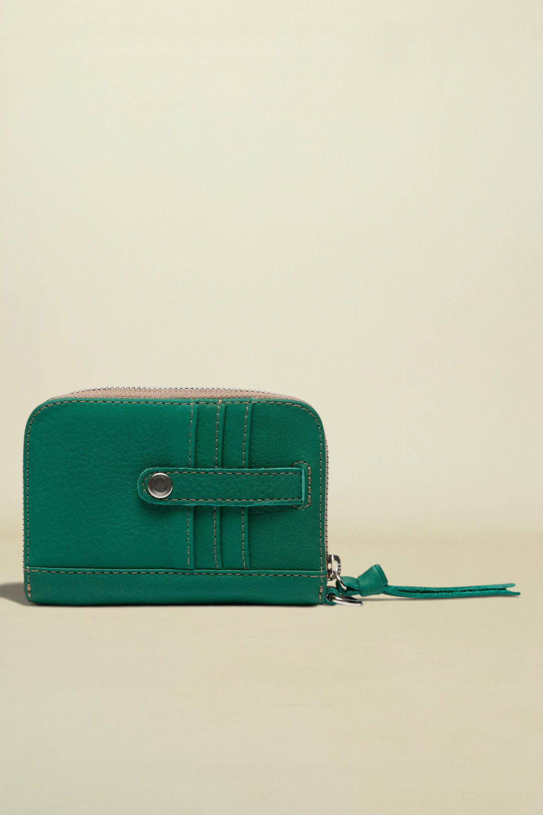 Green wallet with a zipper on a white background