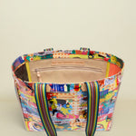 Multicolored tote bag with a patterned design on a white background