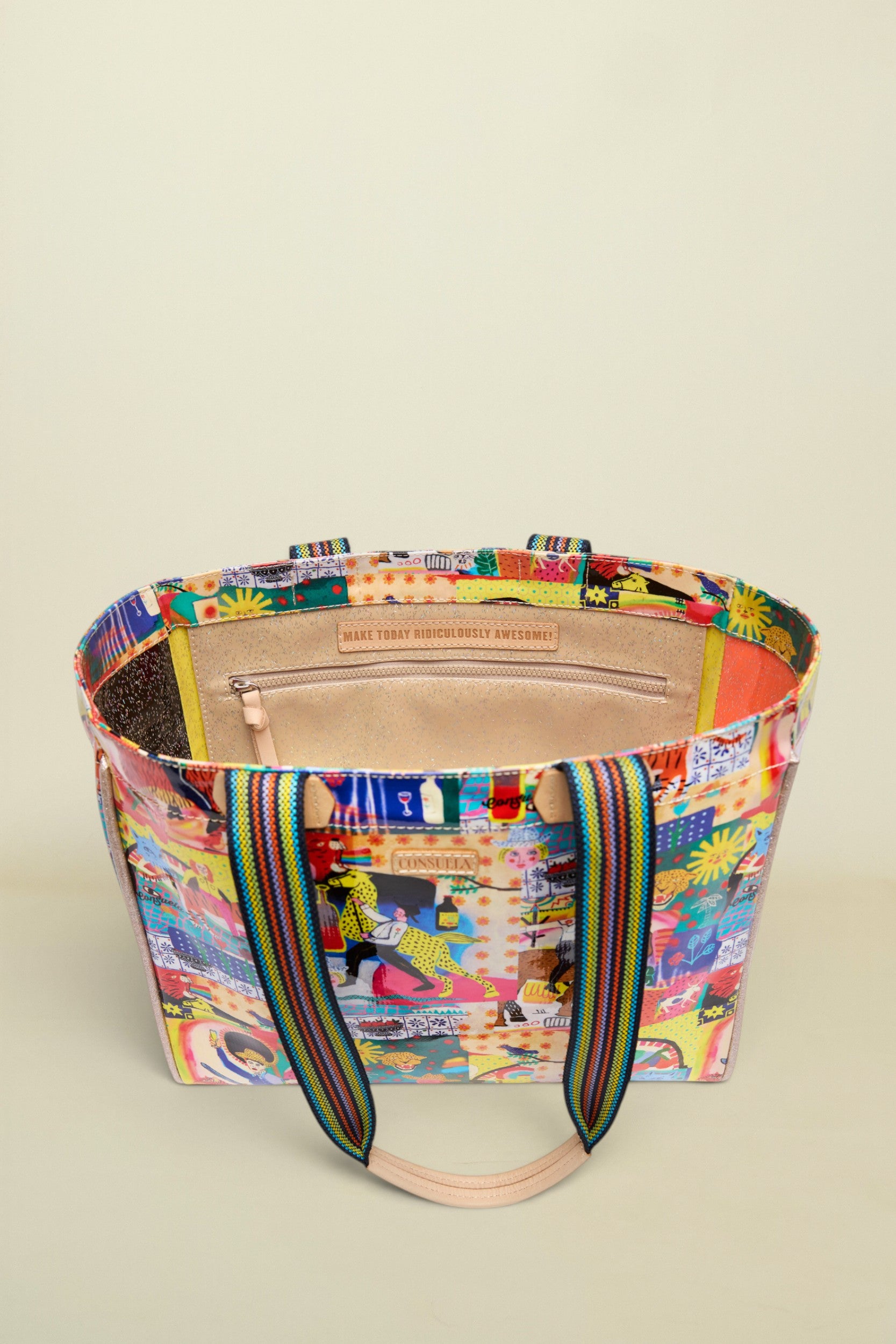 Multicolored tote bag with a patterned design on a white background