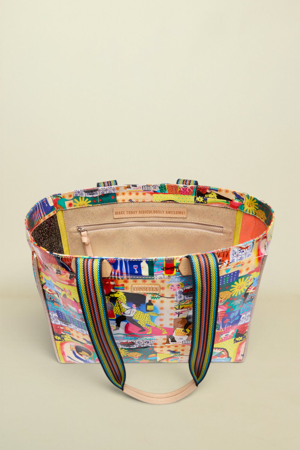 Multicolored tote bag with a patterned design on a white background
