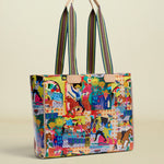 Colorful tote bag with a pattern of people and animals on a white background