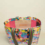 Colorful handbag with a patterned design on a white background