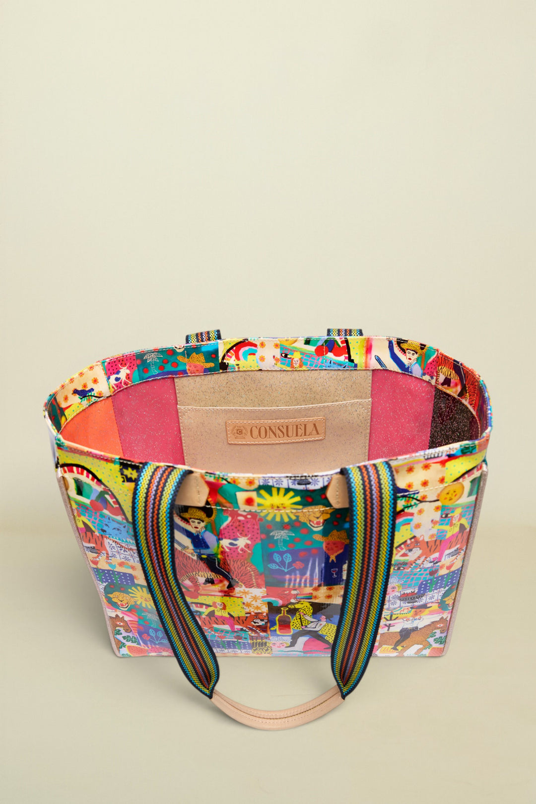 Colorful handbag with a patterned design on a white background