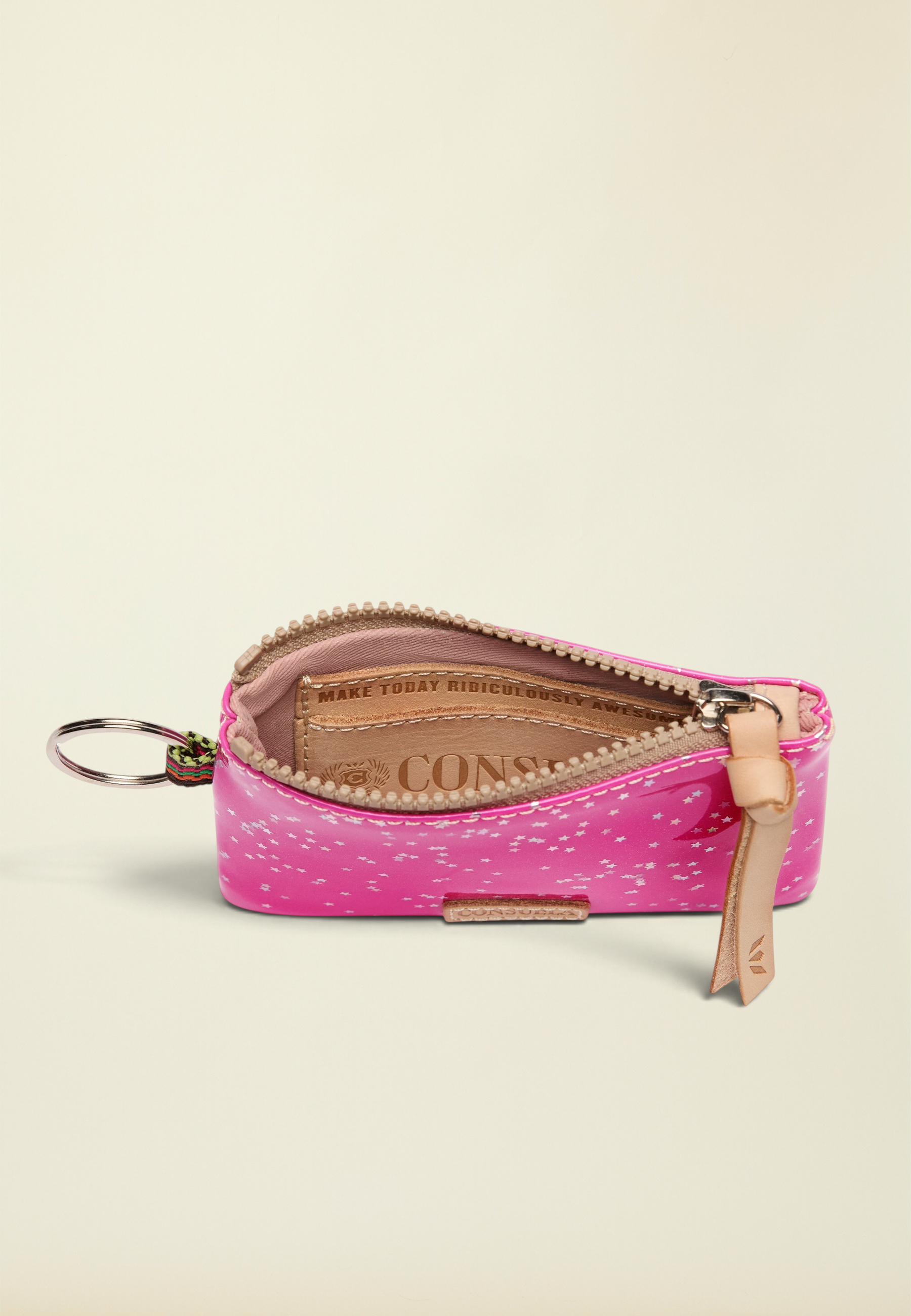 Point of Origin Consuela Berry Pouch in bright pink with star print, leather pull, and interior card slot.