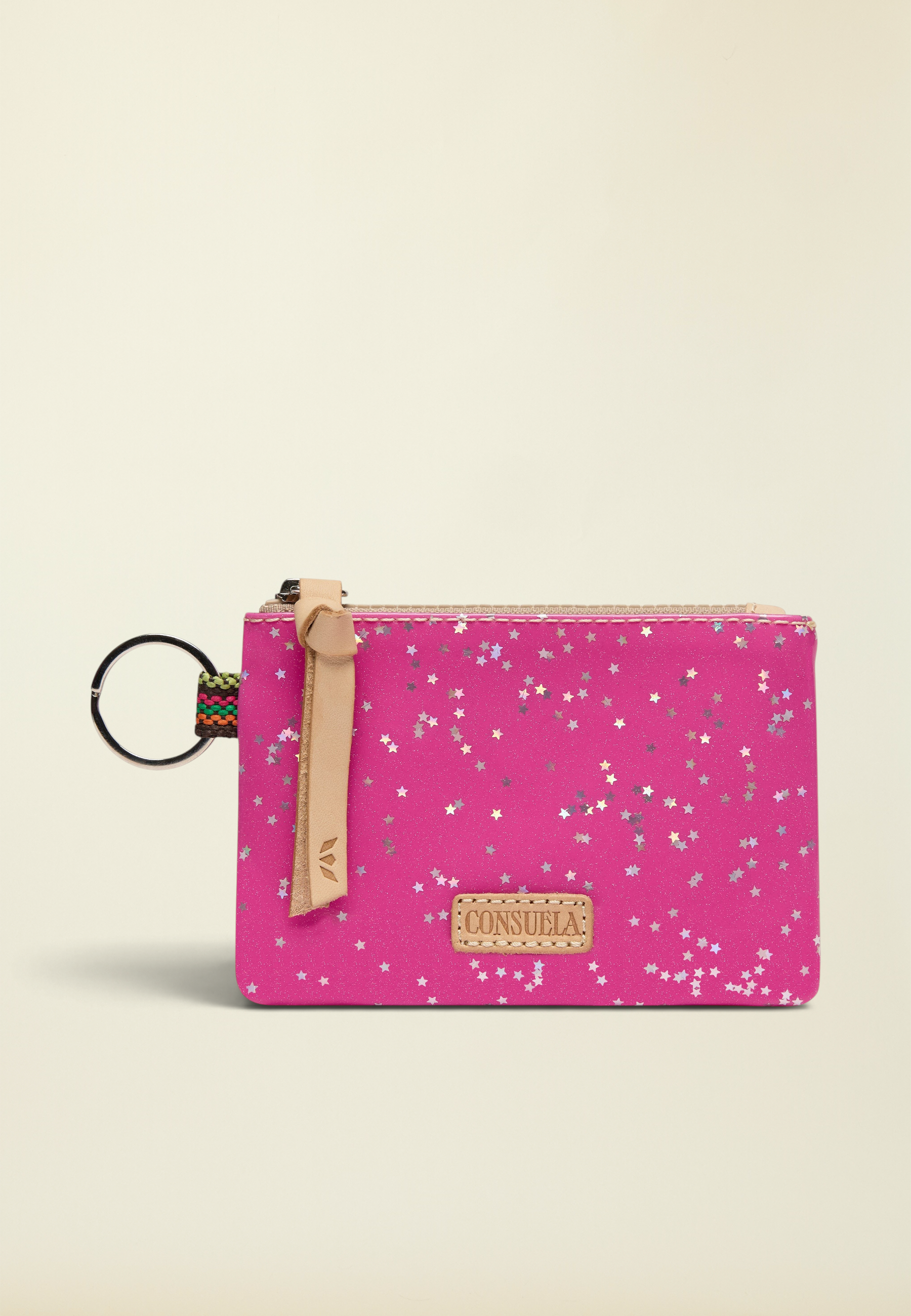 Point of Origin Consuela Berry Pouch in bright pink with silver star print, leather zipper pull, and metal keyring.