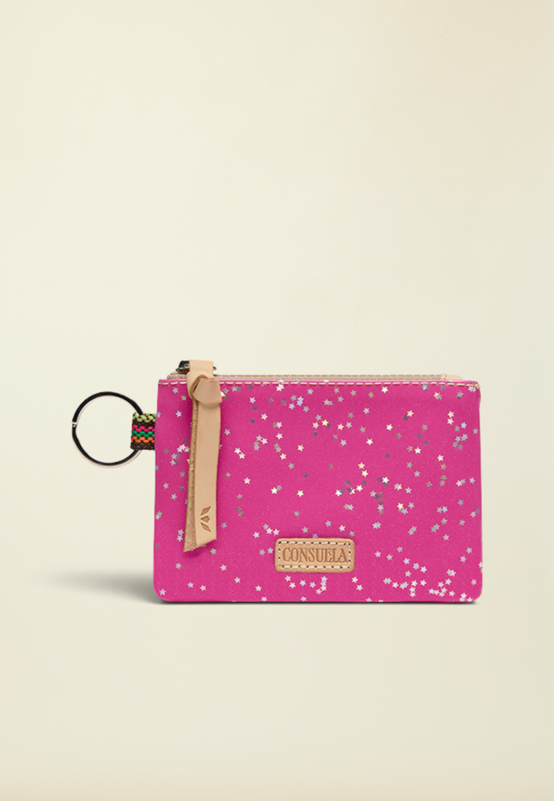 Point of Origin Consuela Berry Pouch in bright pink with silver star print, leather pull, and attached metal keyring.