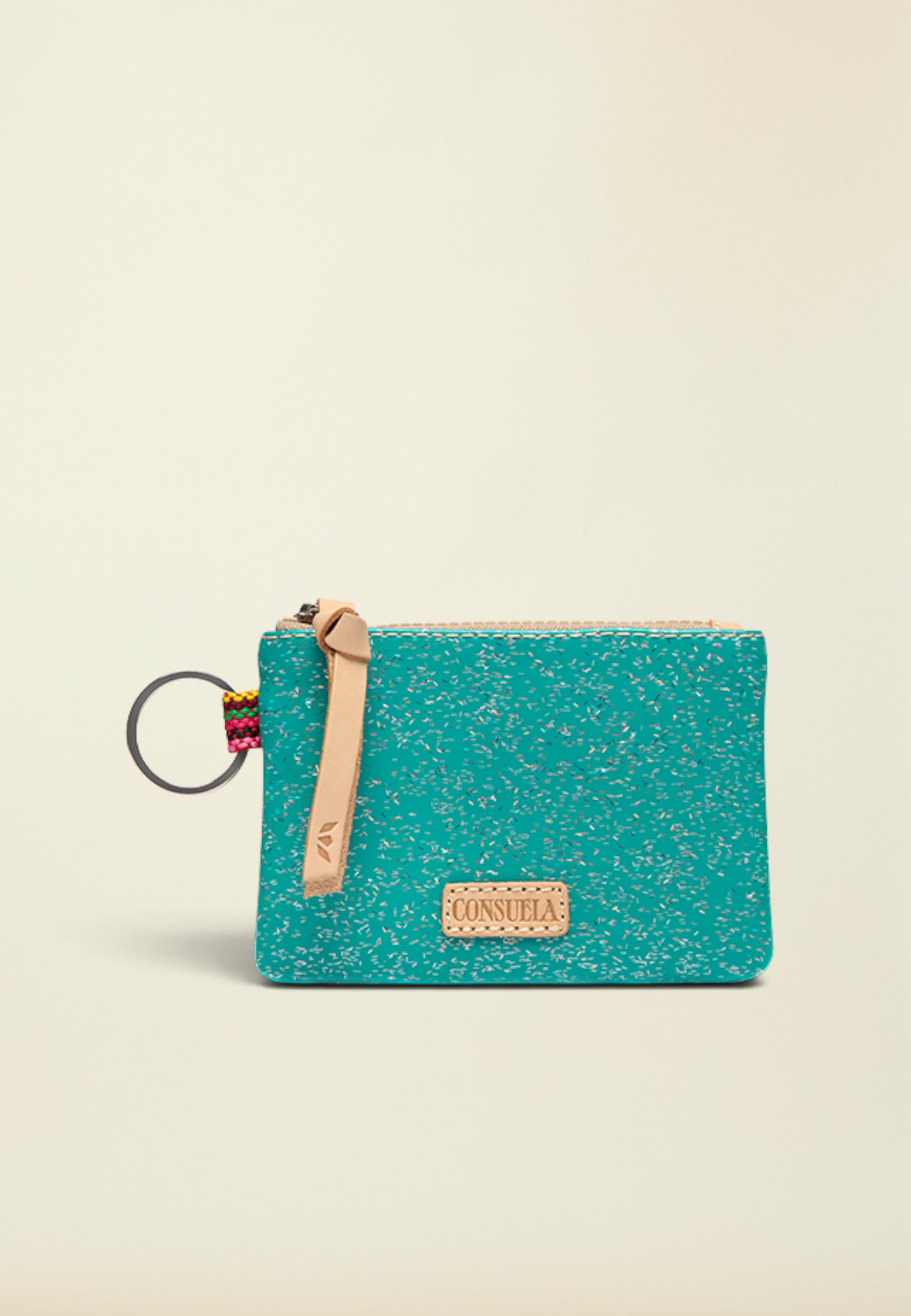 Point of Origin Consuela Shay glitter pouch in teal with a natural leather zipper pull and attached metal keyring.