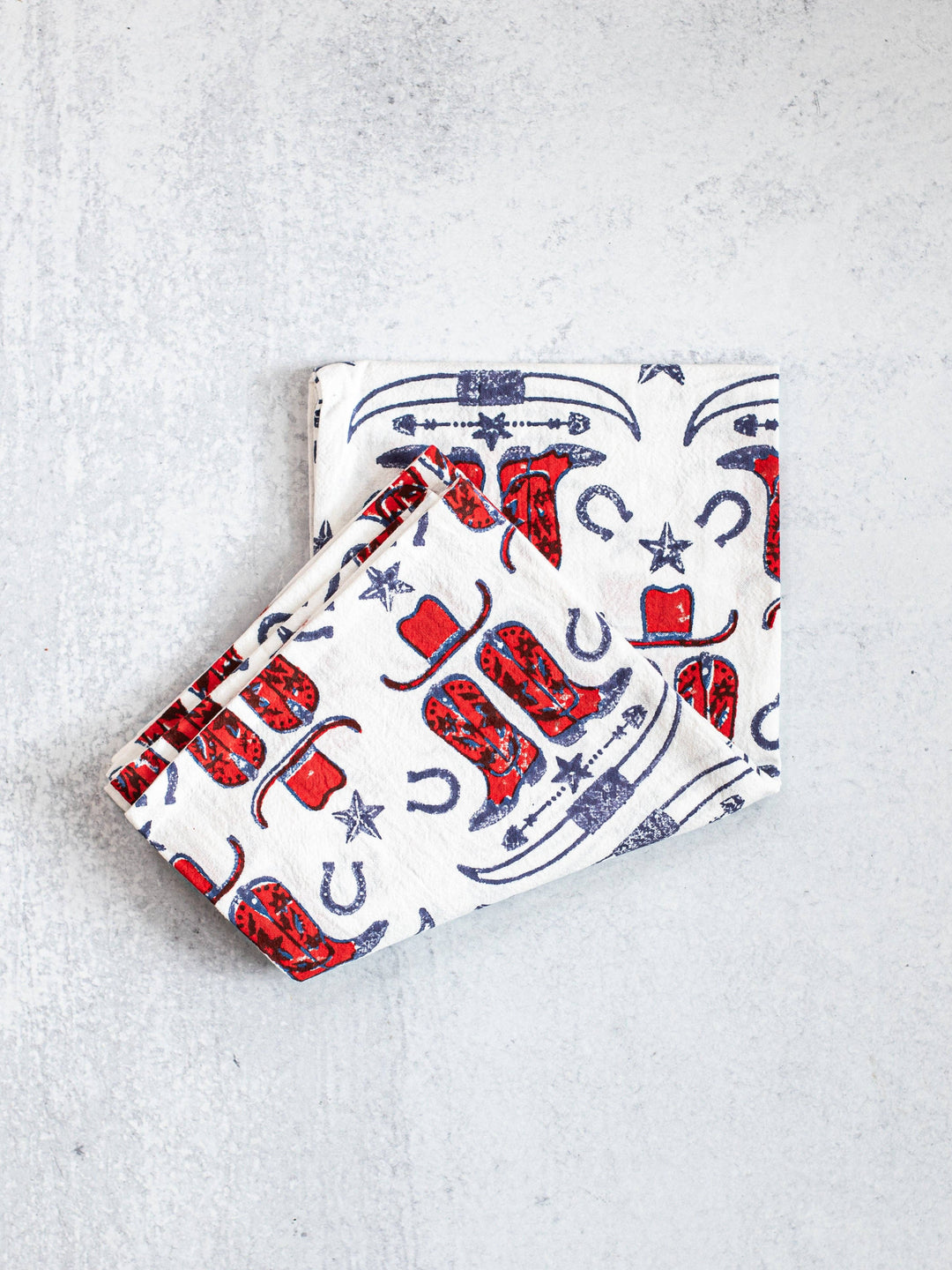 Two fabric pouches with cowboy pattern on a light gray background