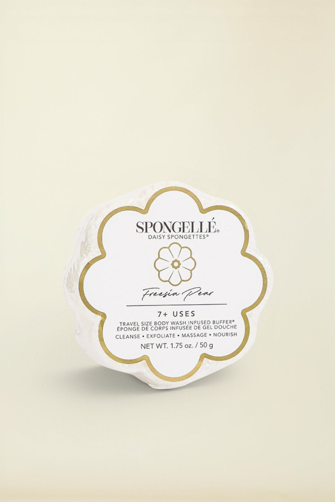 A white floral-shaped Spongelle product packaging with the brand name and product line 'Freesia Pear Daisy' prominently displayed.