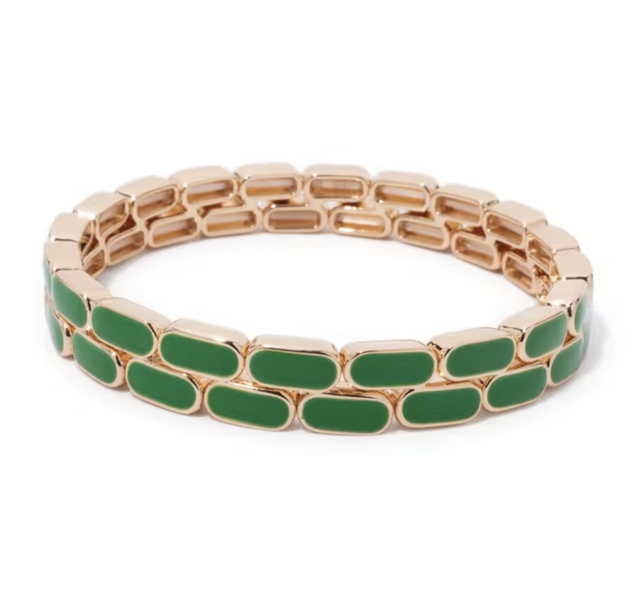 Green bracelet with gold chain links on a white background