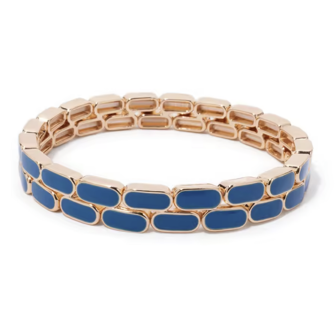 Gold and blue bracelet on a white background