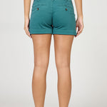Teal shorts worn by a person on a white background