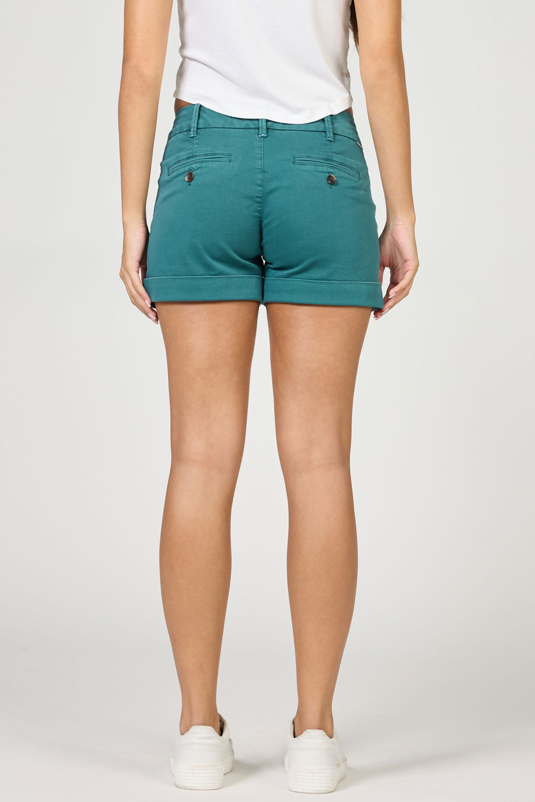 Teal shorts worn by a person on a white background