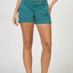 Teal shorts worn by a person on a white background