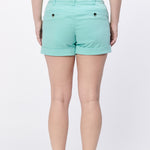 Person wearing light blue shorts on a white background