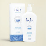 Inis Revitalising Body Lotion 500ml pump bottle next to its matching product packaging box, both in white with blue and navy branding and ocean wave graphics.