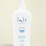 A 500ml white pump bottle of Inis Revitalising Body Lotion on a clean white background.