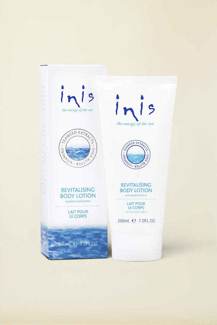 Inis Revitalising Body Lotion 200ml tube and matching outer box, featuring a white design with blue text and ocean wave graphics at the bottom.