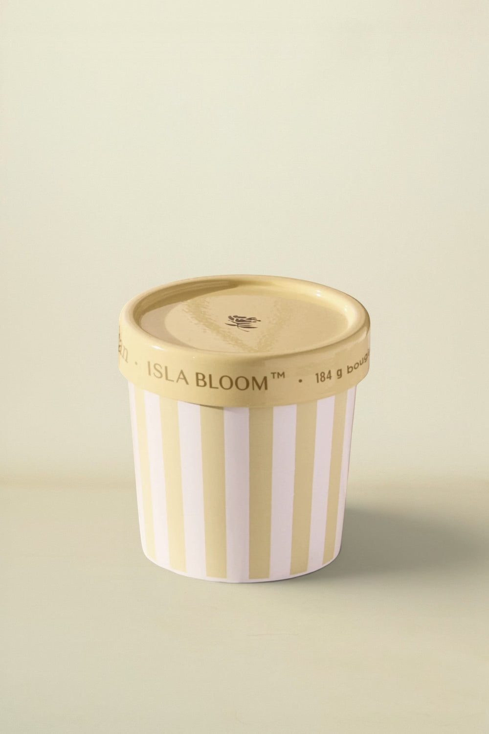 Isla Bloom ice cream container with striped design on a table
