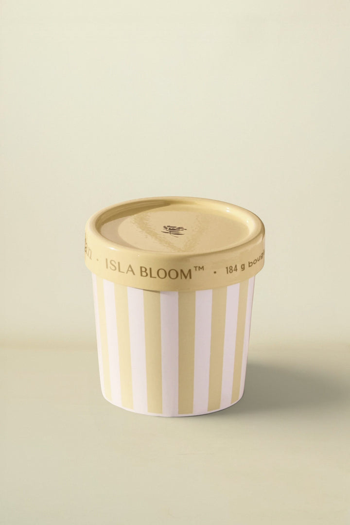 Isla Bloom ice cream container with striped design on a table