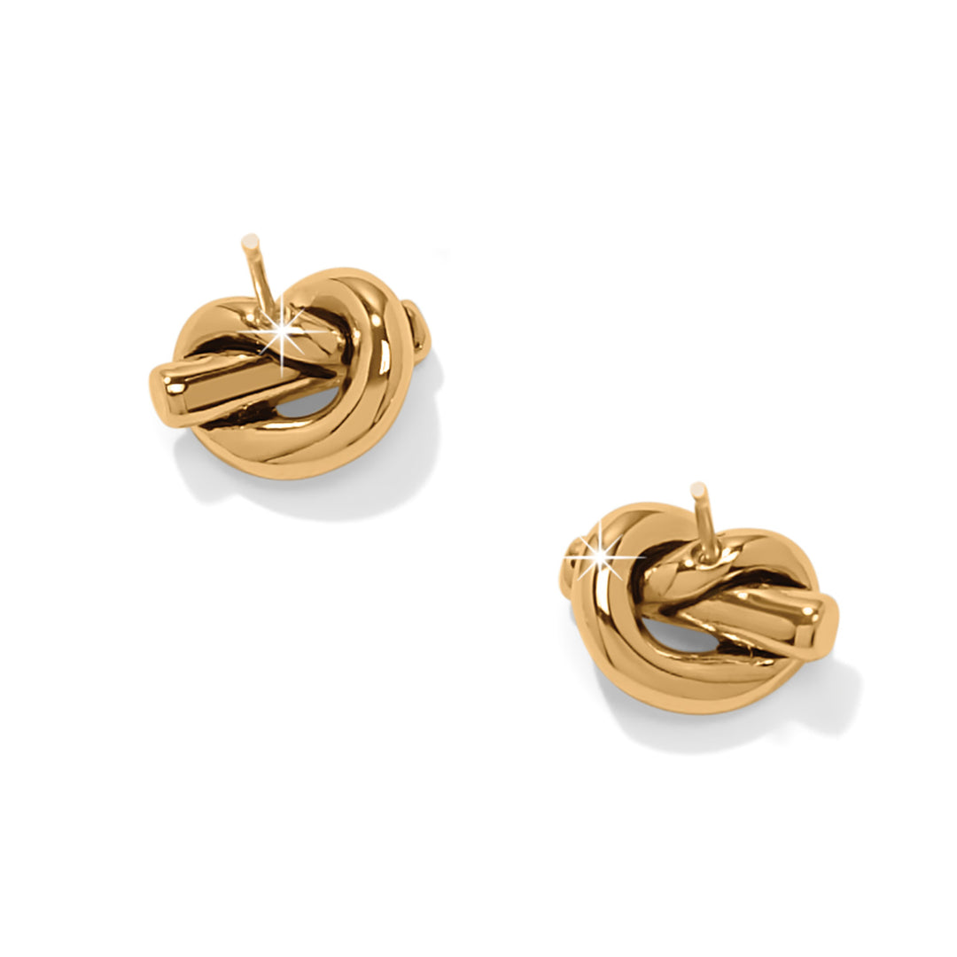 Gold knot earrings on a white background