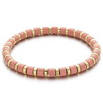 A black and gold colored bracelet with a simple pattern, made of enamel and gold-tone beads.