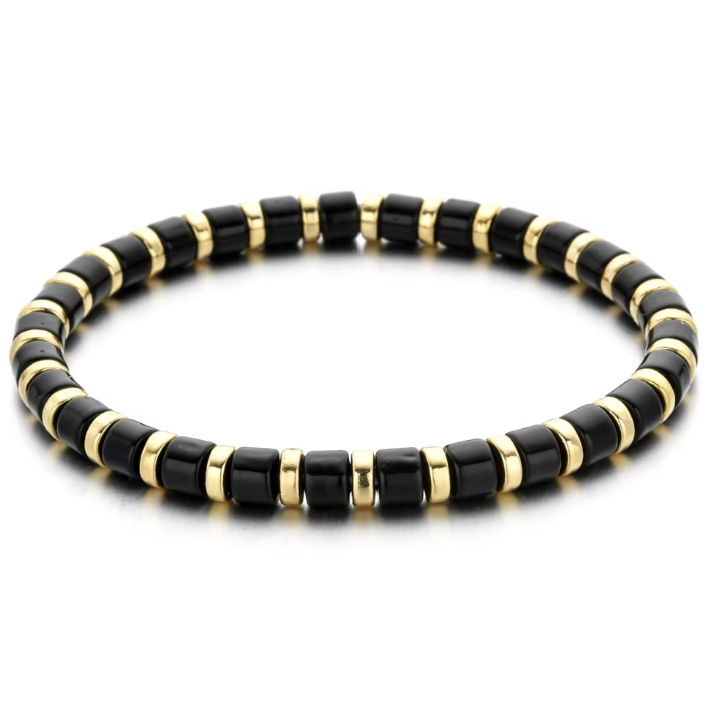 A black and gold colored bracelet with a simple pattern, made of enamel and gold-tone beads.
