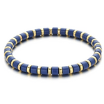 A black and gold colored bracelet with a simple pattern, made of enamel and gold-tone beads.