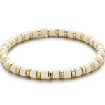 A black and gold colored bracelet with a simple pattern, made of enamel and gold-tone beads.