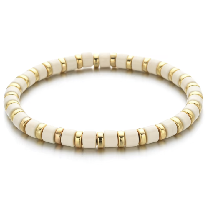 A black and gold colored bracelet with a simple pattern, made of enamel and gold-tone beads.