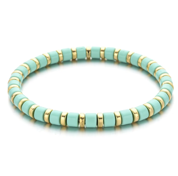 A black and gold colored bracelet with a simple pattern, made of enamel and gold-tone beads.