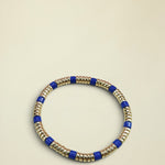 Necklace with blue and gold beads on a white background
