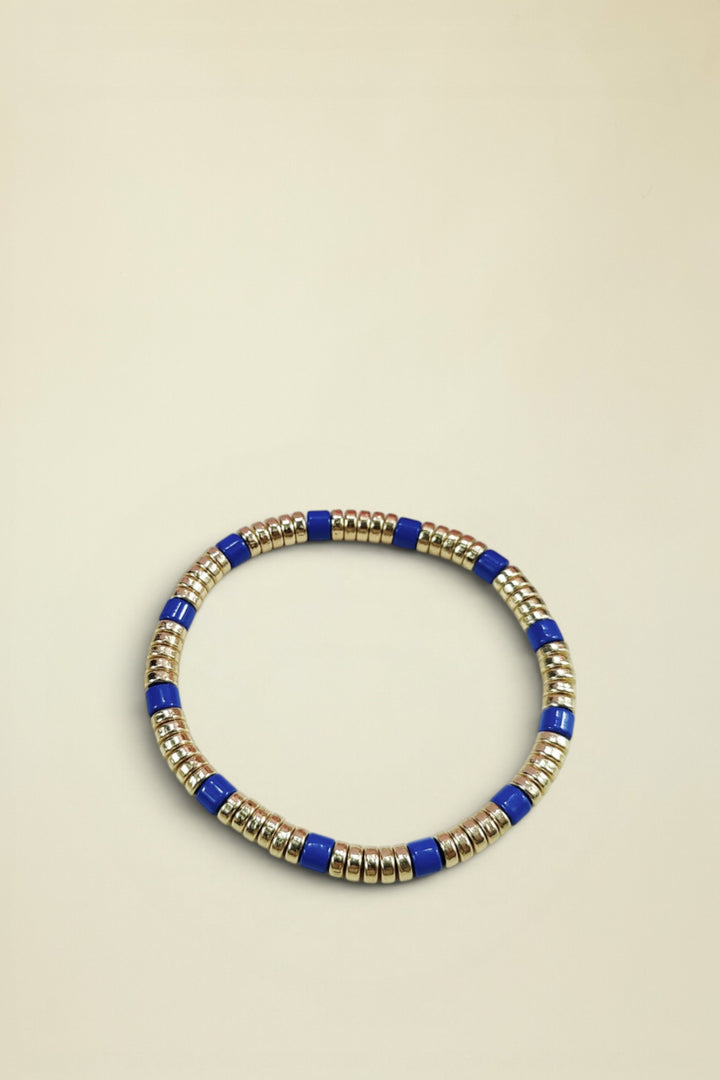 Necklace with blue and gold beads on a white background