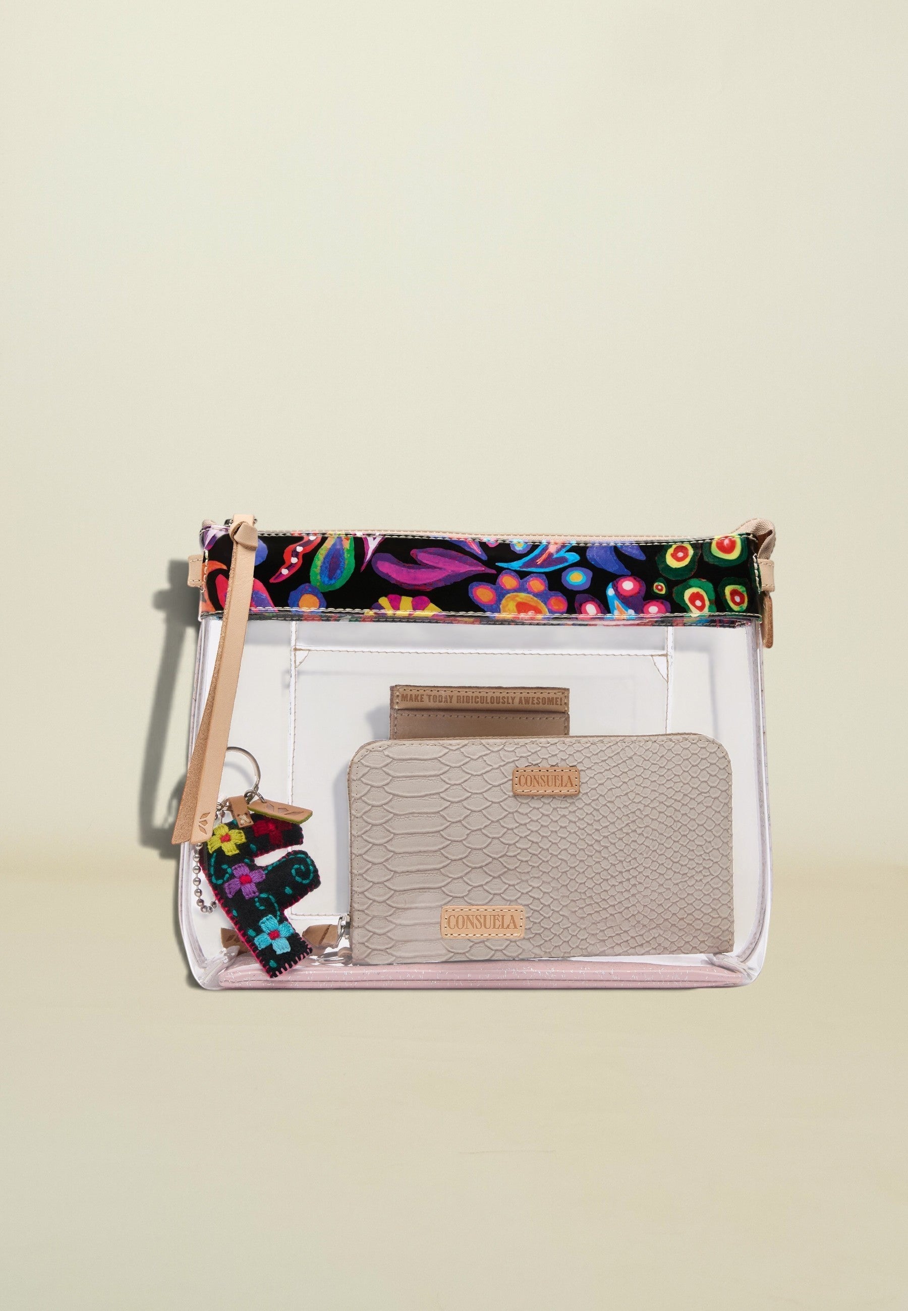 Point of Origin Consuela clear crossbody bag with floral Sophie ConsuelaCloth trim, leather details, and interior pouch.