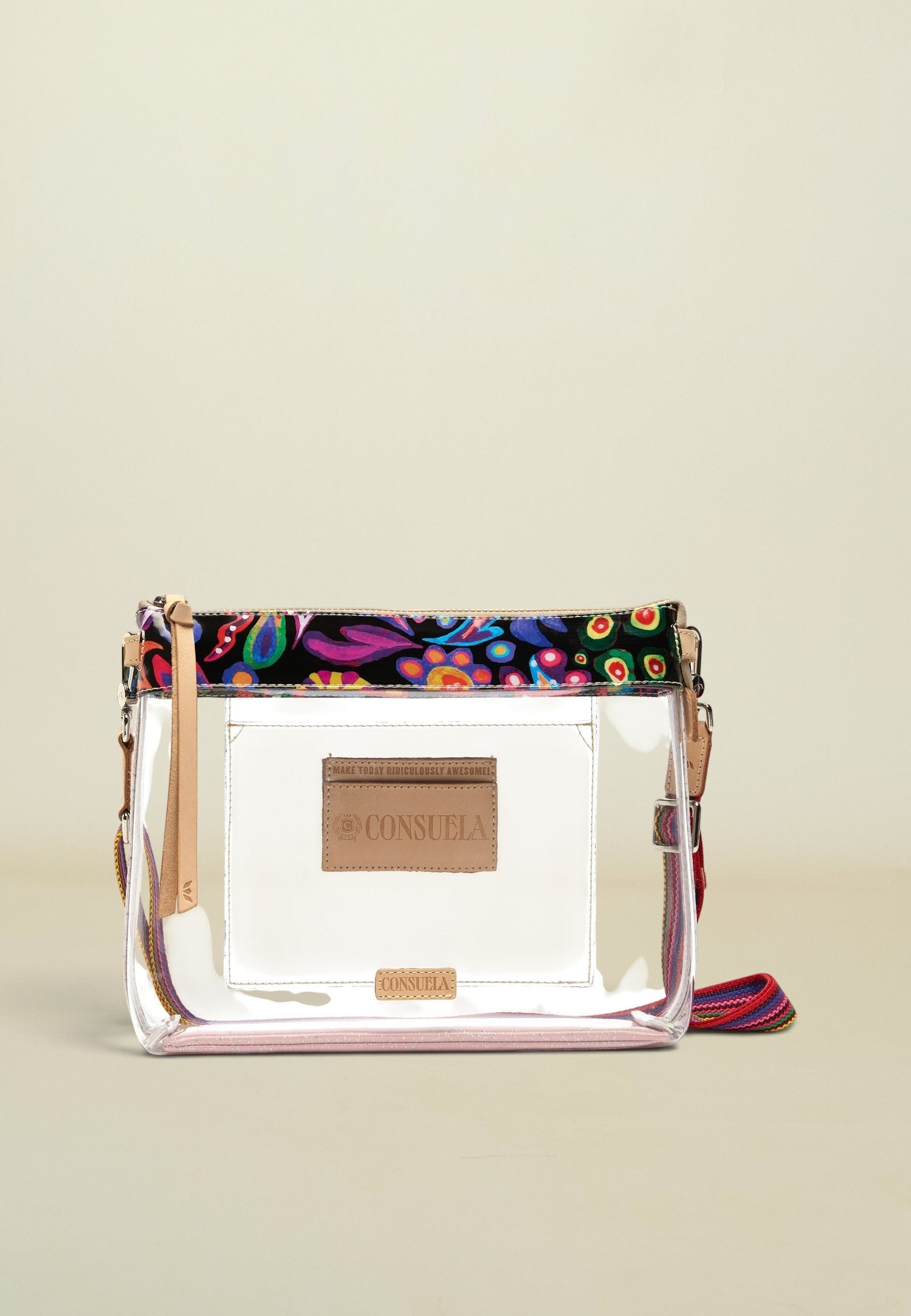 Point of Origin Consuela clear crossbody bag with colorful Sophie floral print trim and natural leather accents.